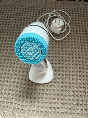 LUMISPA Rechargeable Facial Cleansing Brush in Light Blue and White